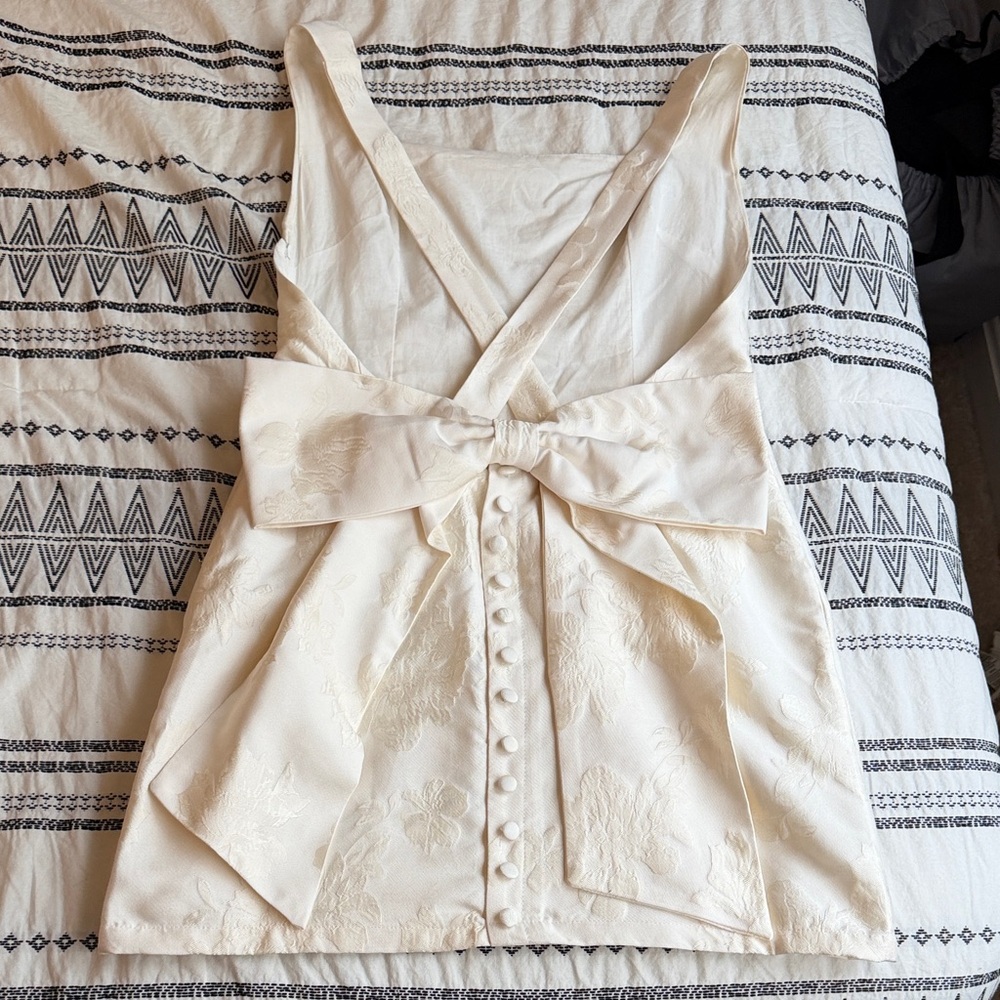 Low bow white bridal mini dress